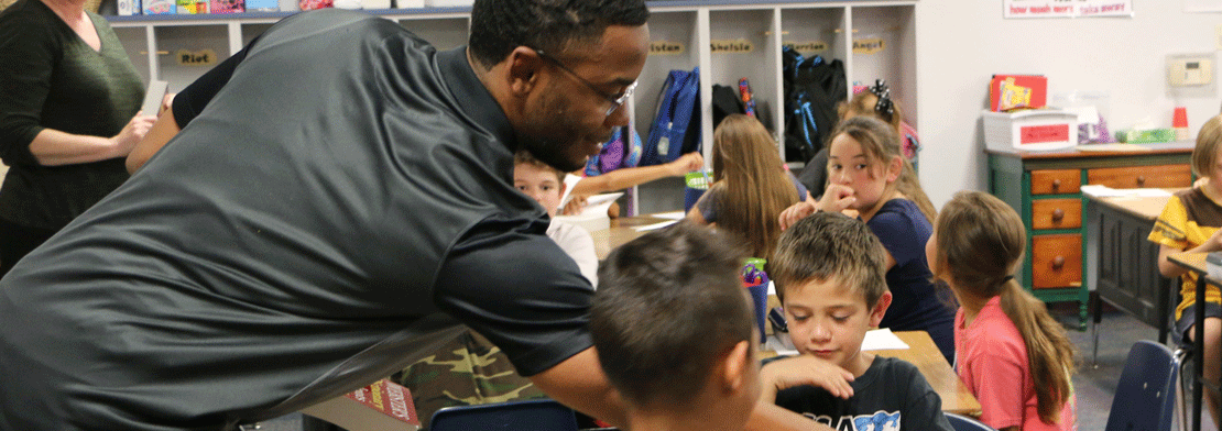 Teacher interacting with students